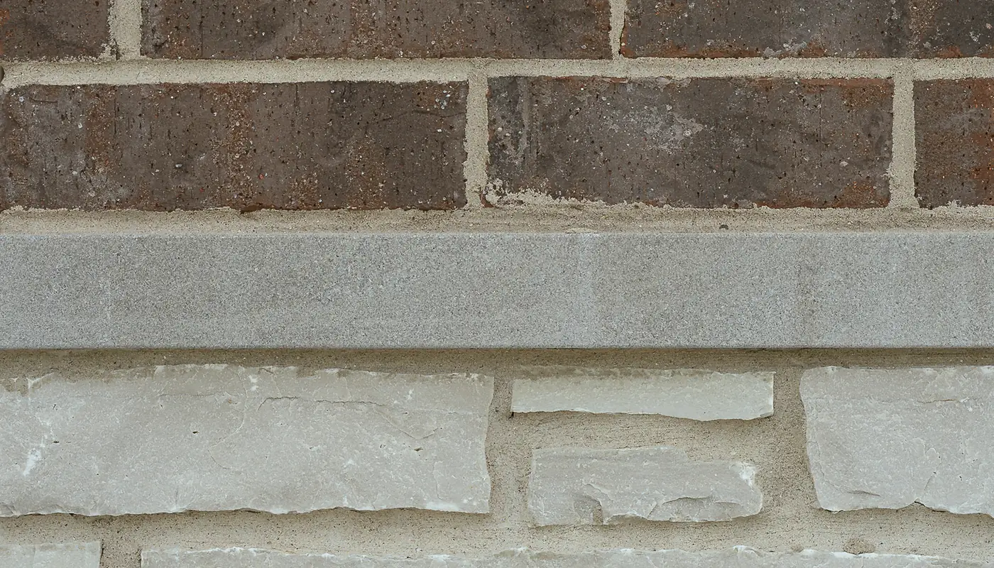 Brick, limestone, and cast-stone exterior material transition